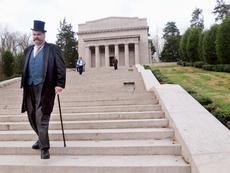Description: <div class="source">Neal Cardin</div><div class="image-desc">President William Howard Taft, portrayed by Dale Liikala of Mentor, Ohio, descends the steps of the Abraham Lincoln Memorial Hall on Monday during a centennial celebration of the opening of the building. President Taft was the featured speaker 100 years ago.</div><div class="buy-pic"><a href="http://www.lcni5.com/cgi-bin/c2newbuyphoto.cgi?pub=053&orig=1114memorial1.jpg" target="_new">Buy this photo</a></div>